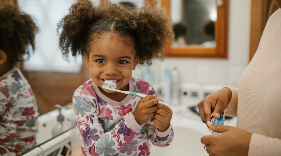 child brushing teeth