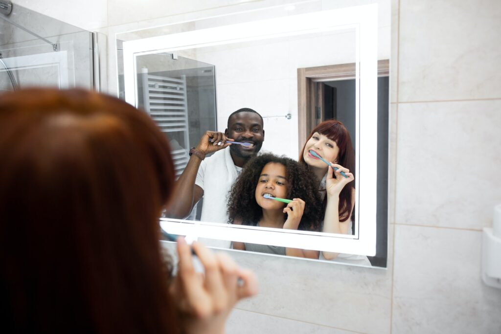 family brushing teeth