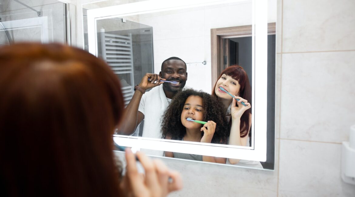 family brushing teeth