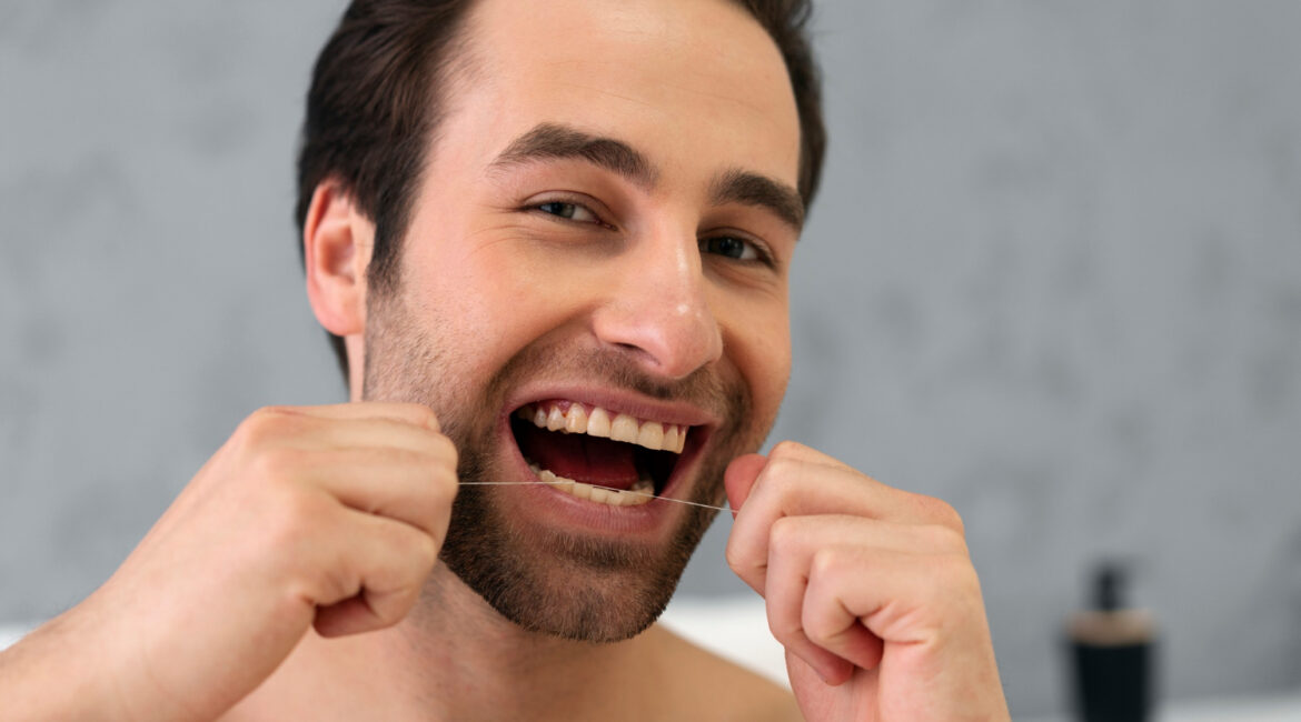 man flossing