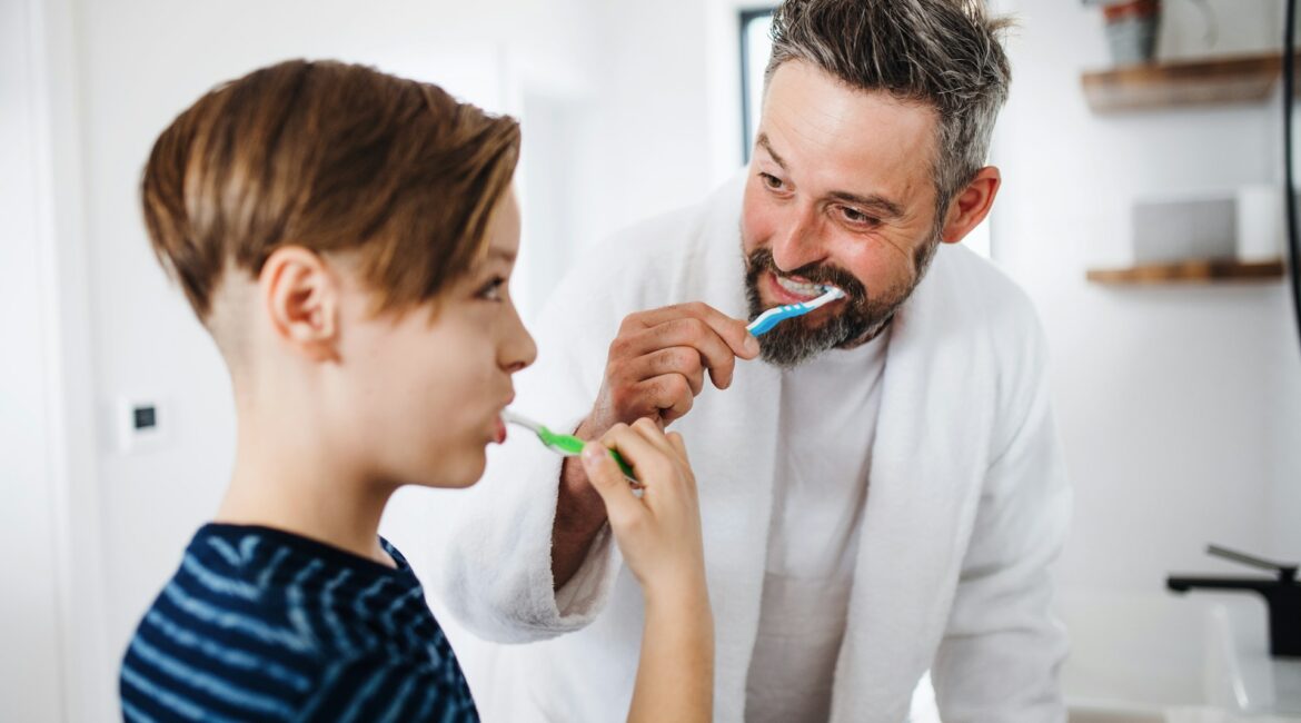 family brushing teeth